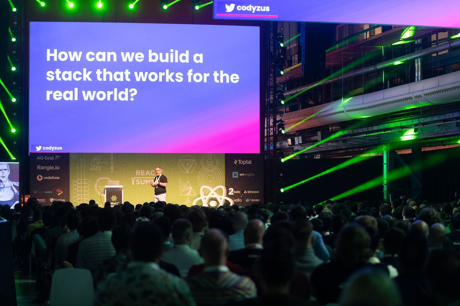 Cody presenting the technology stack at react summit