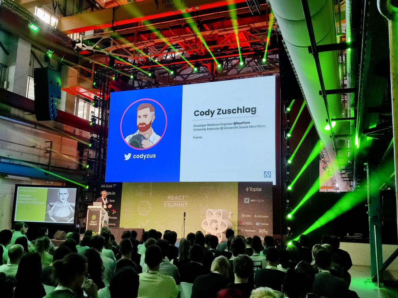 Cody presenting his title slide at react summit