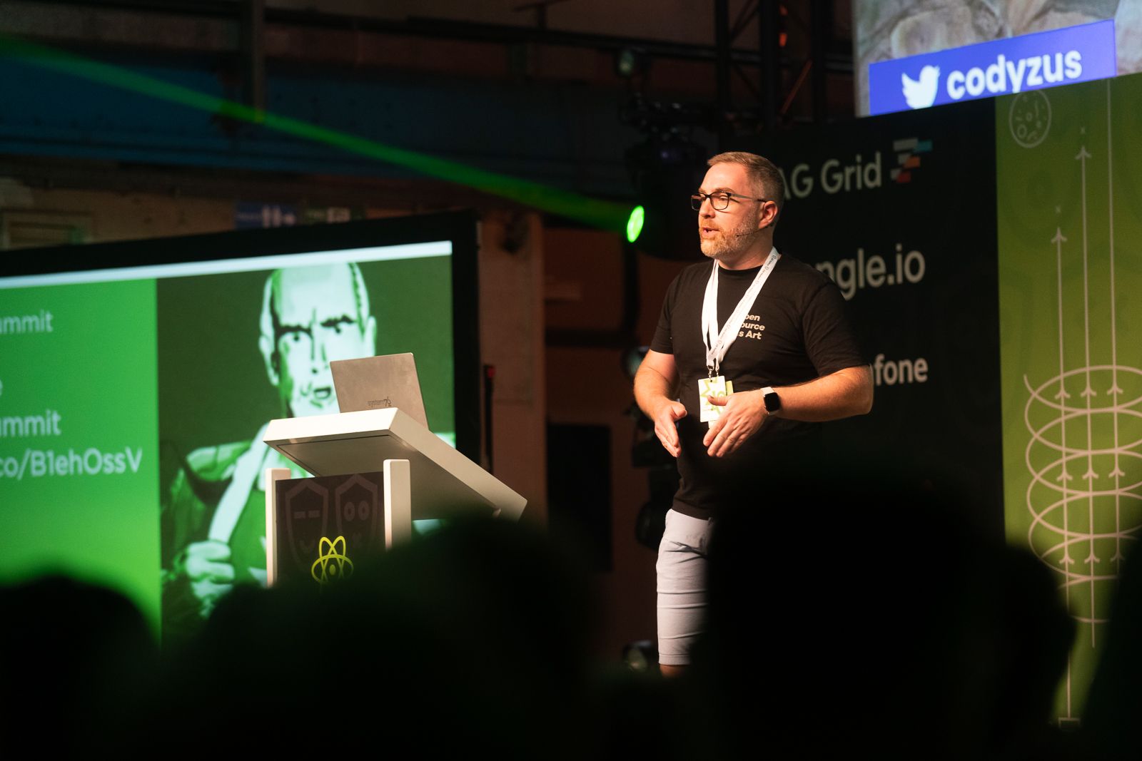 Cody Zuschlag speaking on stage at React Summit